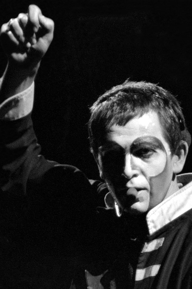 Peter Gabriel wearing the facepaint of Shock the Monkey performing live in concert